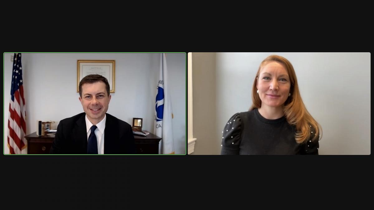 A Zoom screenshot of Melanie Stansbury and Secretary Pete Buttigieg
